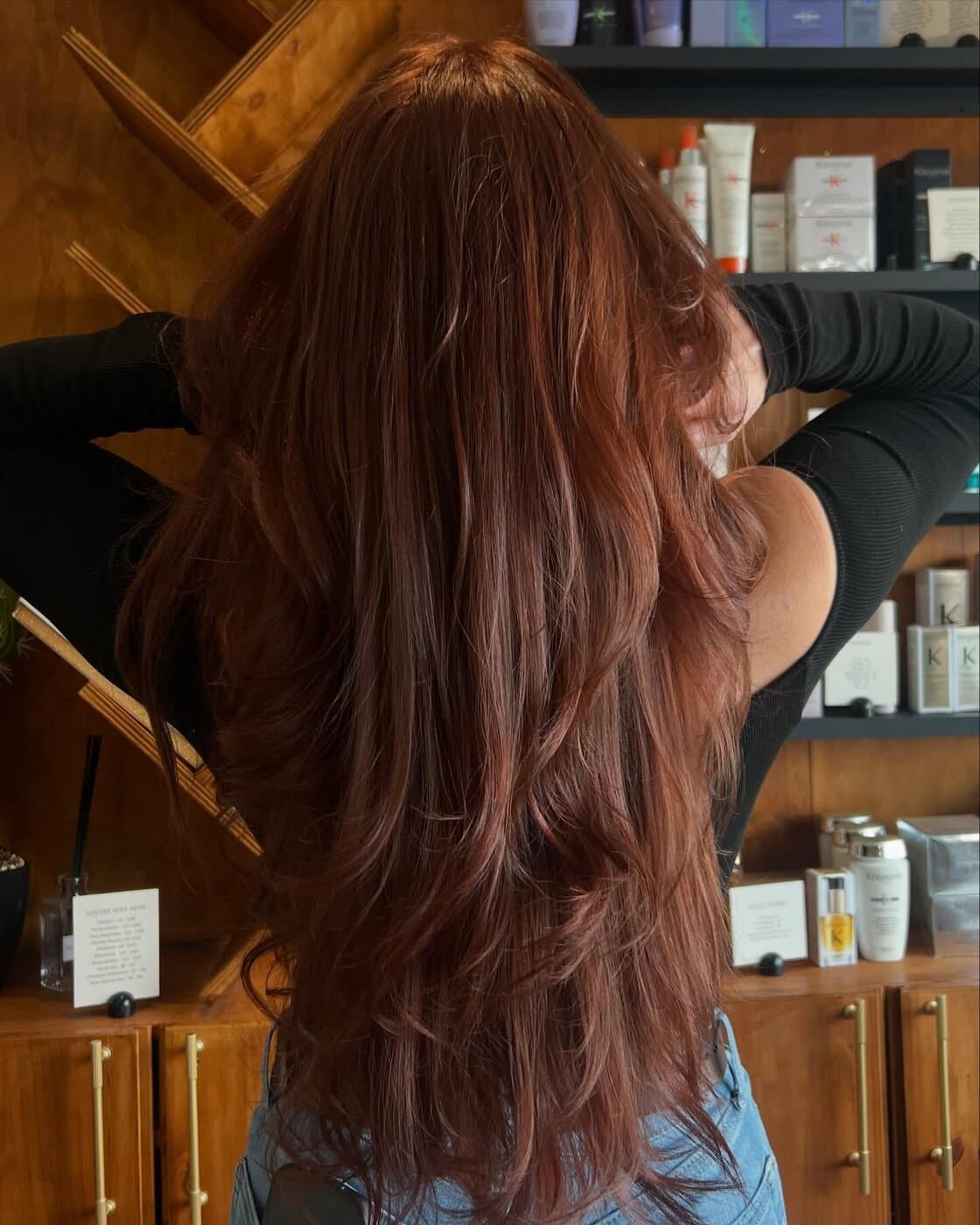 Long copper-auburn color with face-framing layers