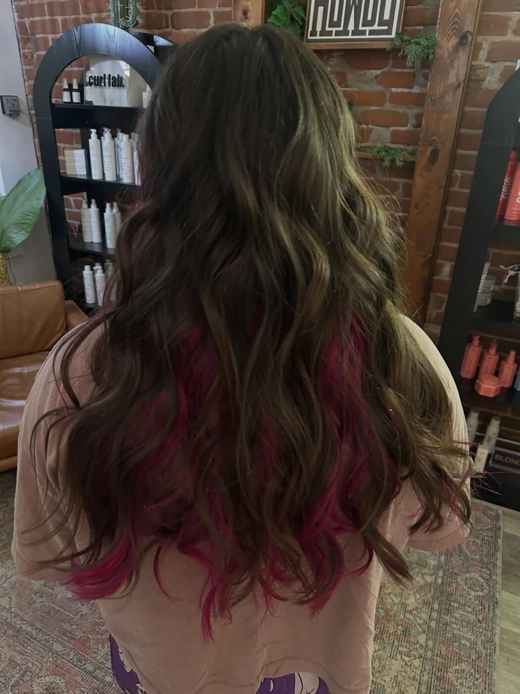 Brunette with vivid magenta peekaboo underlights